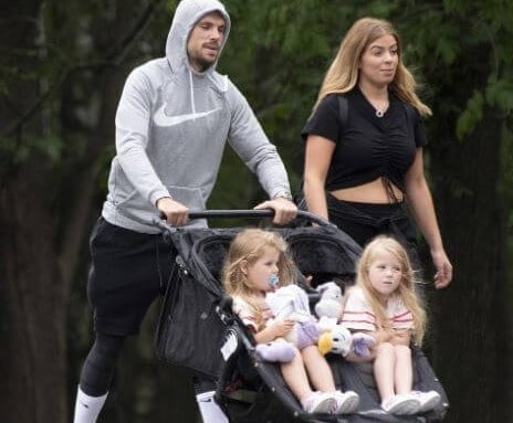 Elexa Henderson with her family members by carrying a doll.